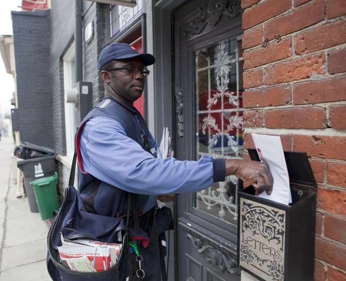 Mailman dropping off a letter